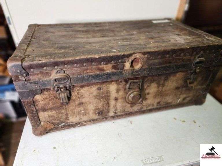 FLAT TOP STORAGE TRUNK - 31" WIDE X 17" DEEP 12 1/2" TALL - HANDLES TORN - LOCKING CLASP IS LOOSE - SHOWS WEAR - TOP IS CRACKED INSIDE - NO TRAY (UPSTAIRS) image