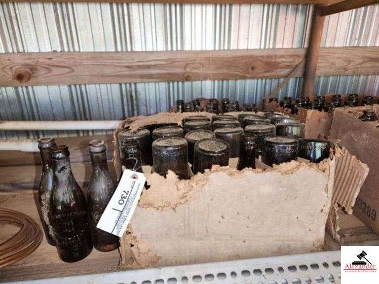 (2) BOXES OF COCA COLA  AMBER BOTTLE - 75TH ANNIVERSARY - COMMEMORATIVE BOTTLE - JACKSON, TN - 42 +/- BOTTLES - DIRTY NEED WASHING - (IMP. SHED) image