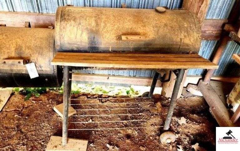 BREAKMAN SMOKEN PIT GRILL STORED IN BARN - GRILL IS WORN AND RUSTY - CHARCOAL STARTER - WITH RACKS - (IMP SHED) image