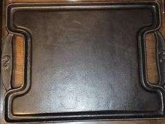 Cast iron Emeril griddle, double sided (ridged and flat).