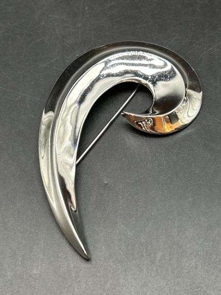 Chrome finish spiral swoosh brooch