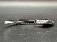 Chrome finish spiral swoosh brooch