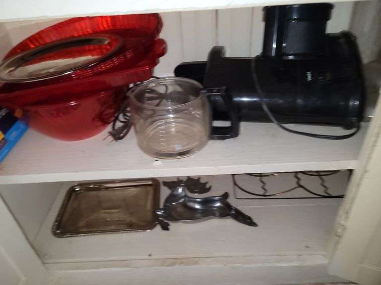Items in cabinet: plastic red ware, Krups, reindeer tray and more