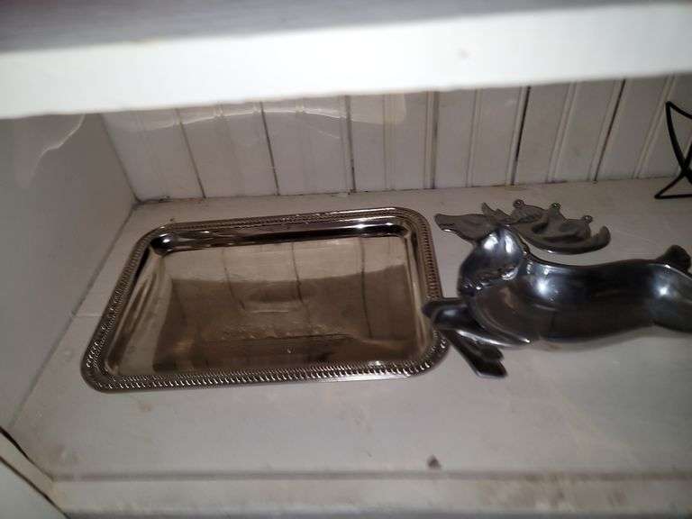 Items in cabinet: plastic red ware, Krups, reindeer tray and more
