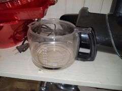 Items in cabinet: plastic red ware, Krups, reindeer tray and more