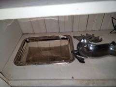 Items in cabinet: plastic red ware, Krups, reindeer tray and more
