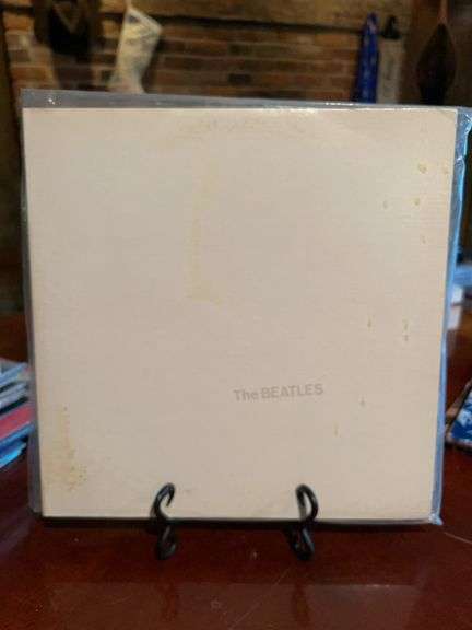 (5) copies of the 1968 album The Beatles, more commonly known as "The White Album”…..very first one includes a poster and individual head shot prints of each member image