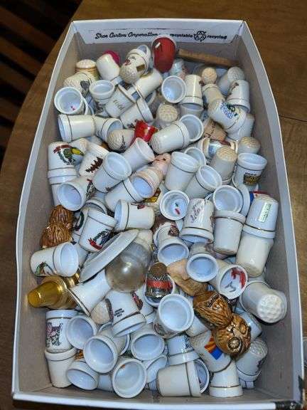 Large collection of ceramic, porcelain, brass and other material thimbles…..too many to take individual pics so please see sampling pics…..also includes small 6-slot display image