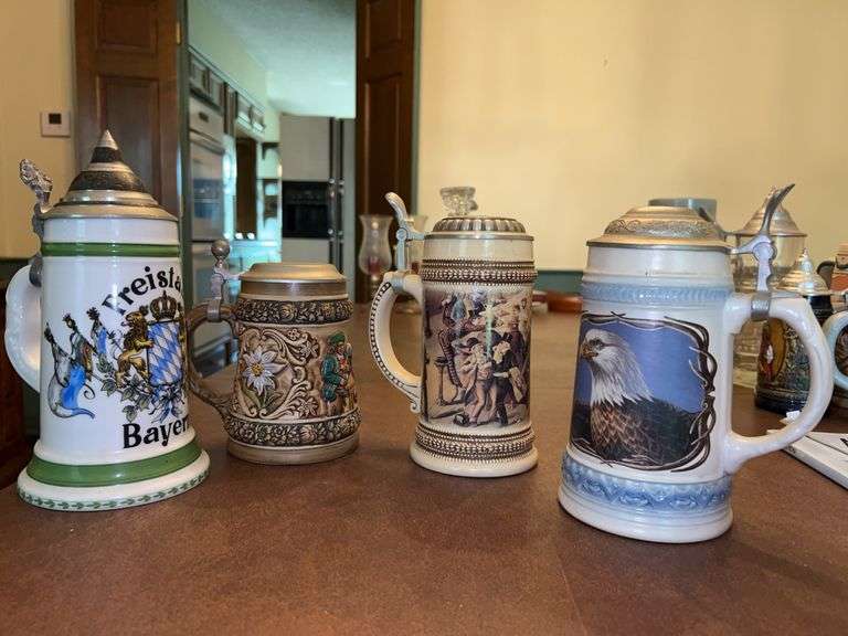 Collection of various size and design steins image