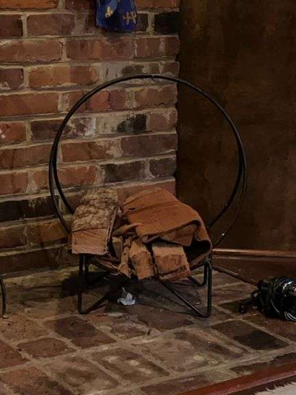 Wrought iron firewood rack and contents image