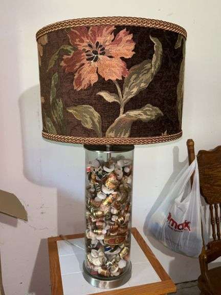 Very unique clear glass base lamp filled with cigar bands and with nice tapestry shade…..28-1/2” tall image