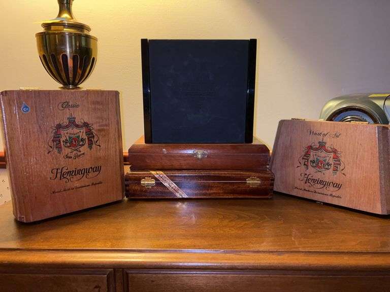Great selection of wood and black lacquer cigar boxes image