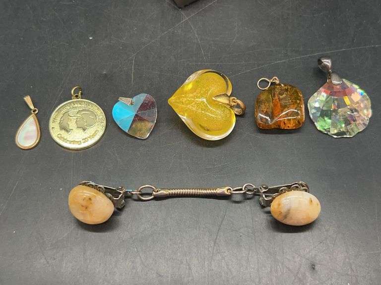 Grouping of beautiful pendants and (1) sweater clip image