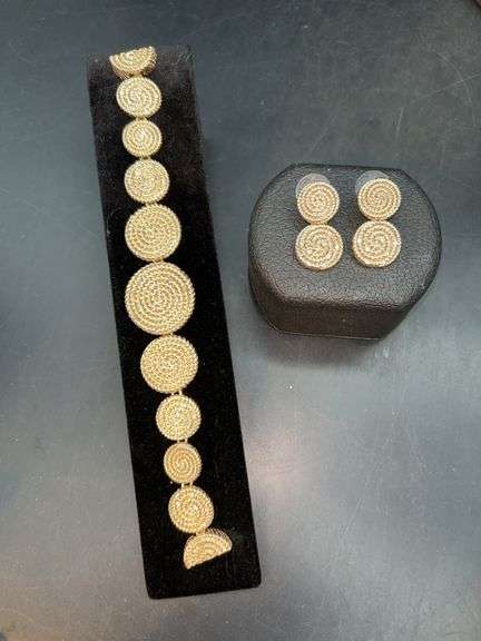 Very nice braided bracelet with matching post-back earrings….each has clear stones image