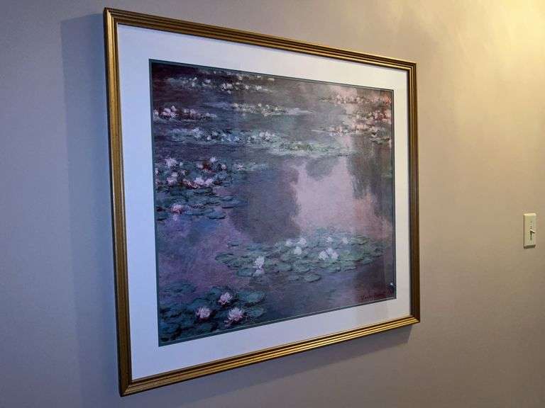 A framed print of Claude Monet's "Water Lilies" series of paintings…..31 x 28 image