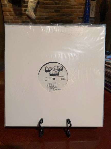 (4) album set of The Beatles…..some songs include Act Naturally, Can’t Buy Me Live, I Want to Hold Your Hand, Hey Jude, Roll Over Beethoven and many more…..all are in protective sleeves image