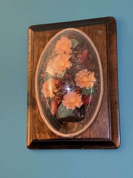 Cute artificial floral wall art under bubble plexiglass image