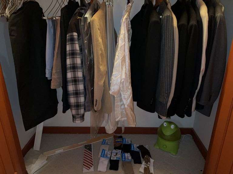 Contents of closet……men’s dress jackets, new socks, pants image