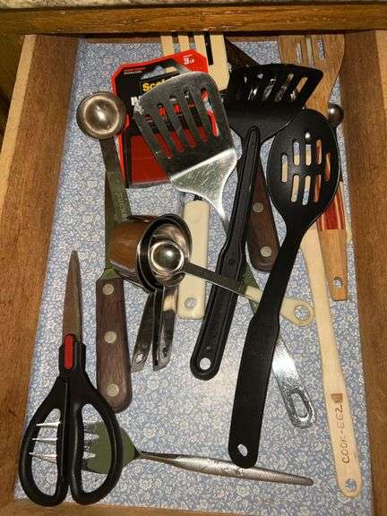 Contents of kitchen drawer and bottom kitchen cabinet image