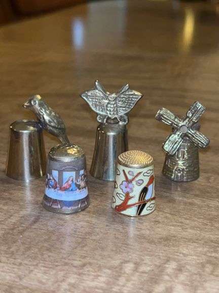 Grouping of brass and brass enamel thimbles image