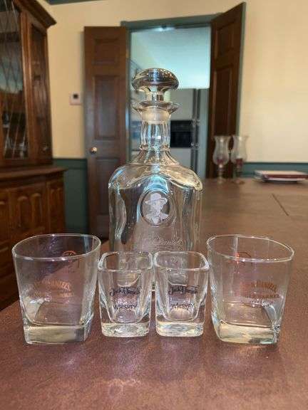 Jack Daniels 25th Anniversary Decanter and (4) miscellaneous Jack Daniels shot glasses image