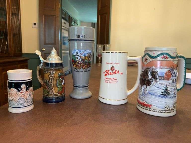 Grouping of various size and design steins image