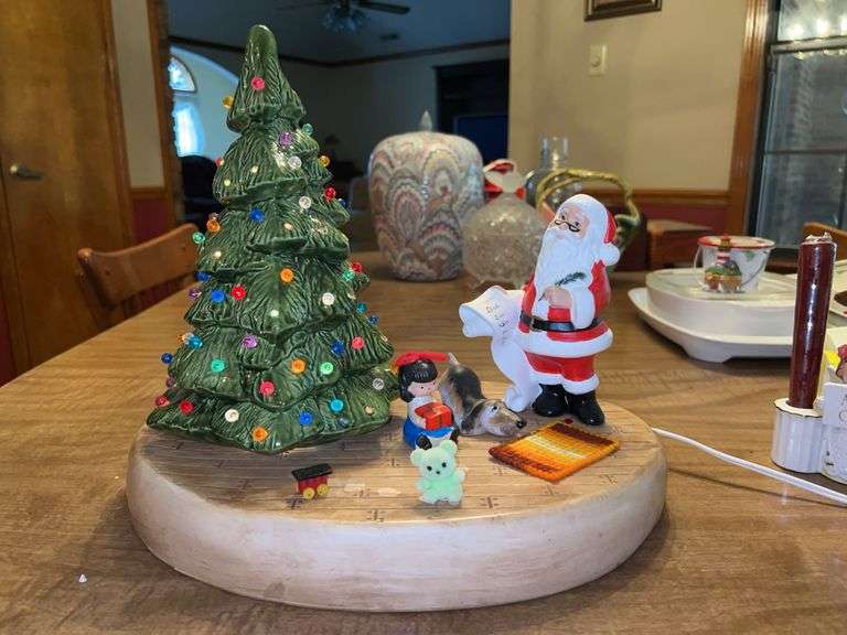 Adorable lighted Christmas scene with ceramic tree…..Santa, the train and teddy bear need glued back to base…..lights on tree blink image