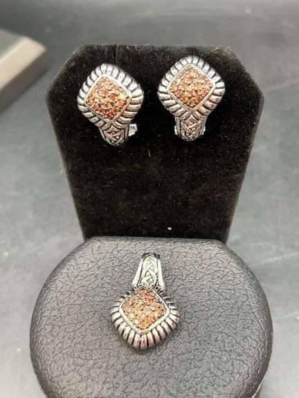 Gorgeous set of silver-toned lever back earrings and a matching pendant with pavé-set orange or brown stones image