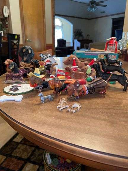 Adorable grouping of dachshunds home decor…..various sizes and materials….one is missing a foot and one tale is broken image