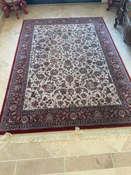 Area rug in colors of maroon, navy tan and cream image