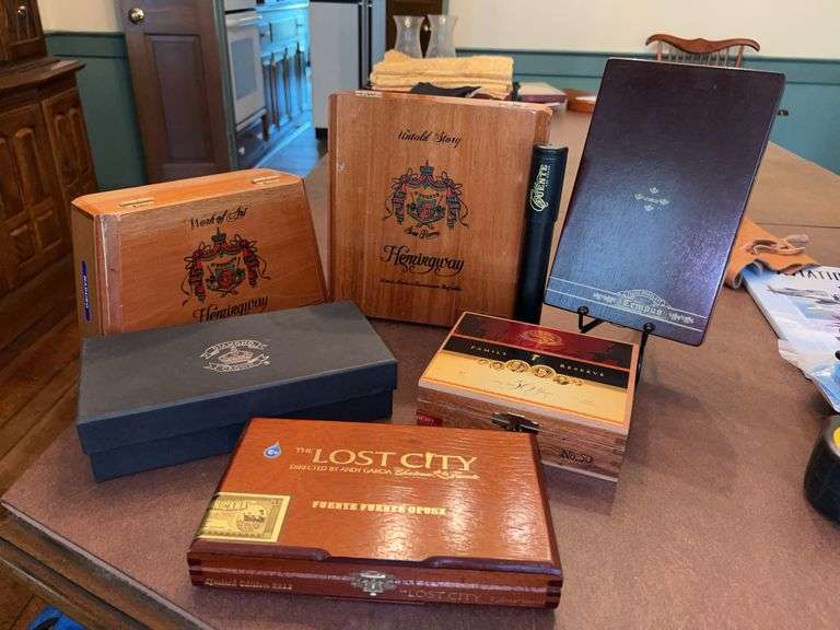 Grouping of wood and other material cigar boxes image