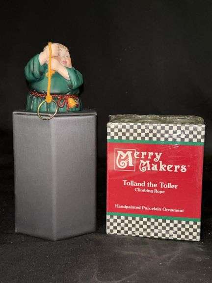 (2) Dept. 56 porcelain Merry Makers “Tolland the Toller Climbing Rope”…..2-1/4” tall and in original box…..both are bells….one box is sealed