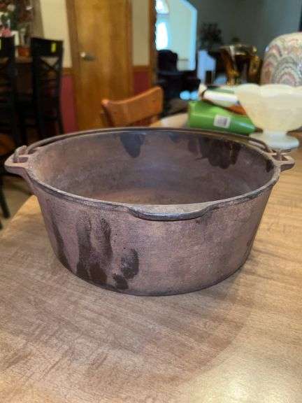 Vintage cast iron Dutch Oven (no lid)…..marked H on bottom and will need cleaned and seasoned image