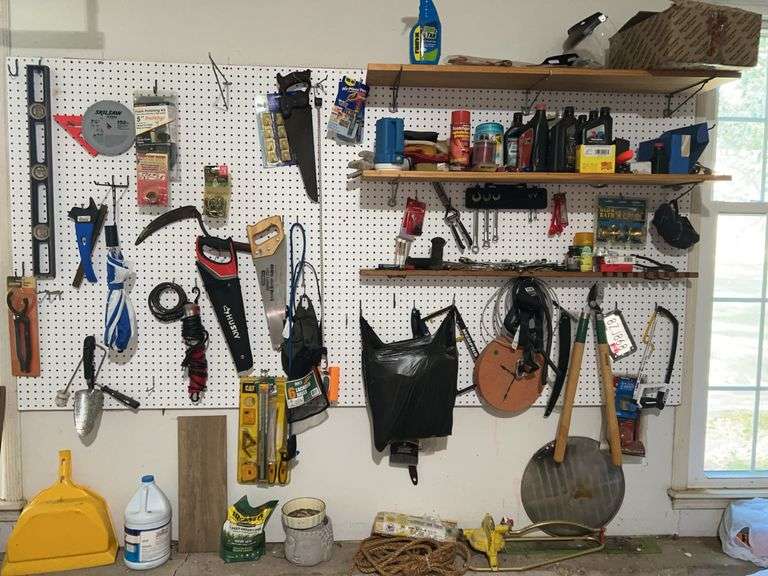Contents of items hanging on wall, on shelves and on lower ledge image