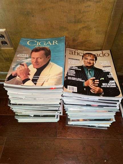 Large stack of CIGAR AFICIONADO magazines with celebrity covers image
