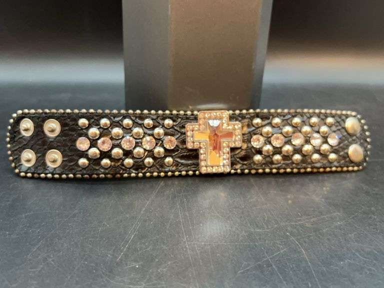 Black leather-like snap bracelet enhanced with multiple rhinestone accents and mirrored cross glass center image