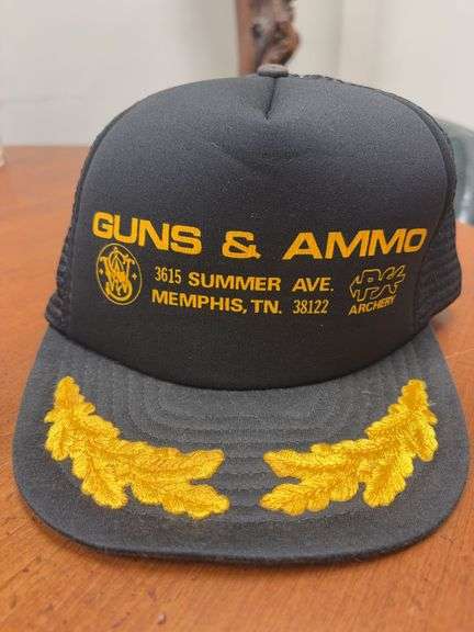 Memphis Guns & Ammo Black and Gold Leaf 23” Band Trucker Hat image