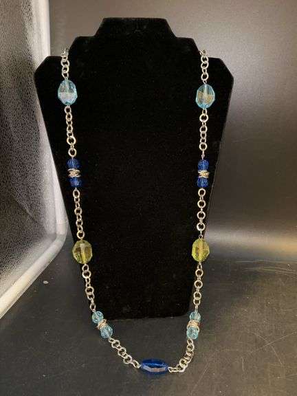 Longer silver tone necklace with green and blue acrylic beading image
