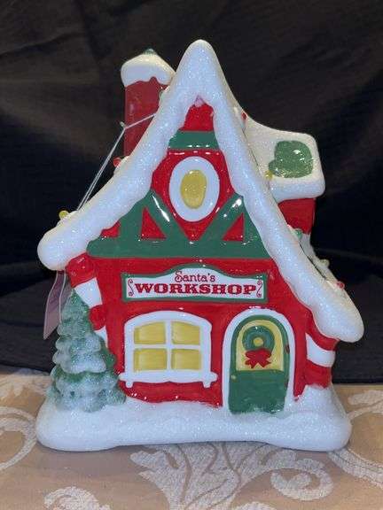 Adorable Hallmark Santa’s Workshop with lights and sounds…..first in the North Pole Village Collector Series….in working condition image