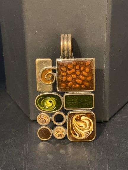 Art deco brass pendant with enameled accents and amber-colored stones image