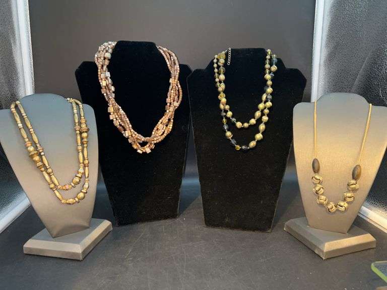Lovely grouping of gold tone single and multi-strand necklaces image