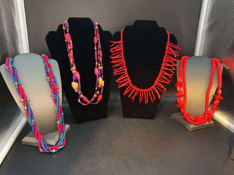 Grouping of brightly colored beaded necklaces image