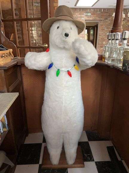 Standing Hen House brand polar bear with string of lights and hat…..Bear is super soft and was use as a greeter at the bar in sun room….56-1/2” tall….arms are jointed image