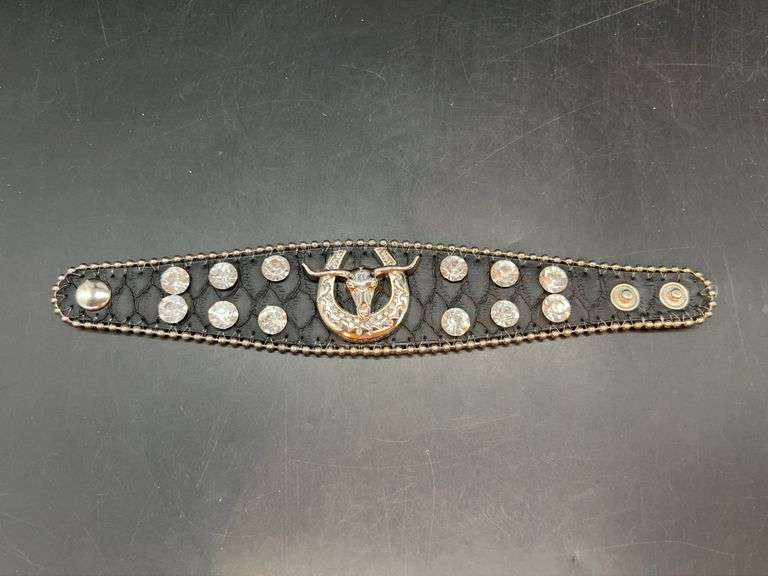Black leather-like snap bracelet enhanced with multiple rhinestone accents and Longhorn/Horseshoe center image