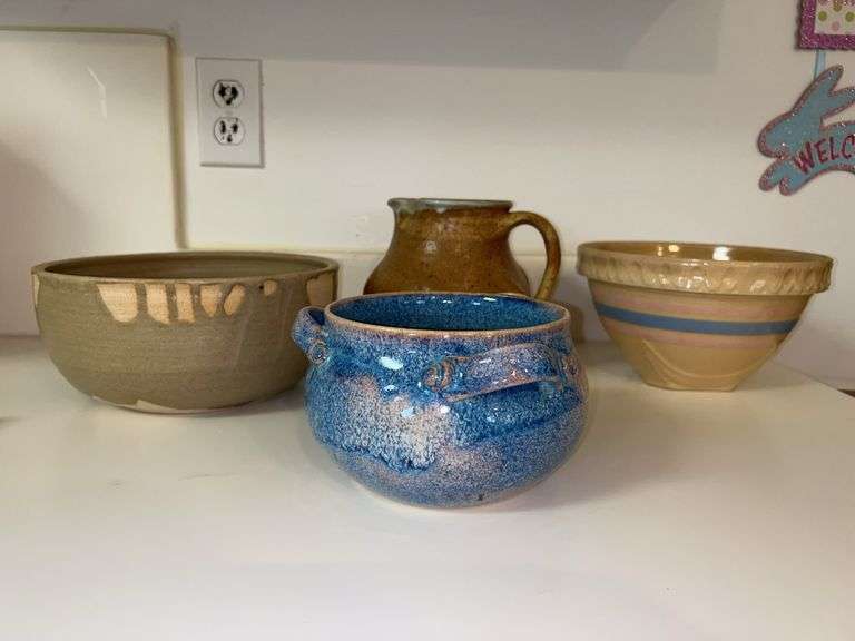 Nice grouping of pottery serving pieces in various sizes image