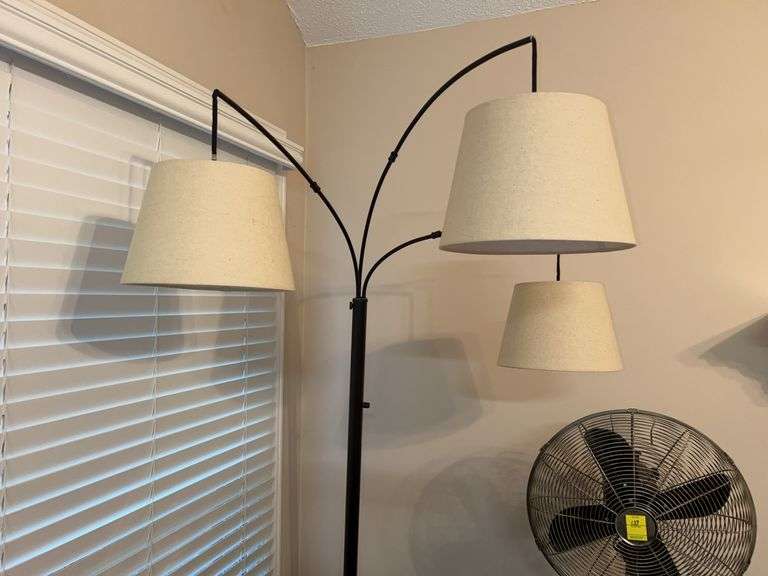 MCM arc floor lamp with a black metal frame and cream linen drum shades image