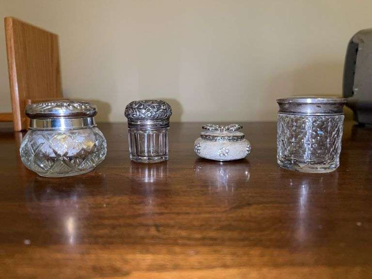 Grouping of (3) small vanity jars with silverplate lids and (2) cast enamel hinged trinket box with butterfly decor image