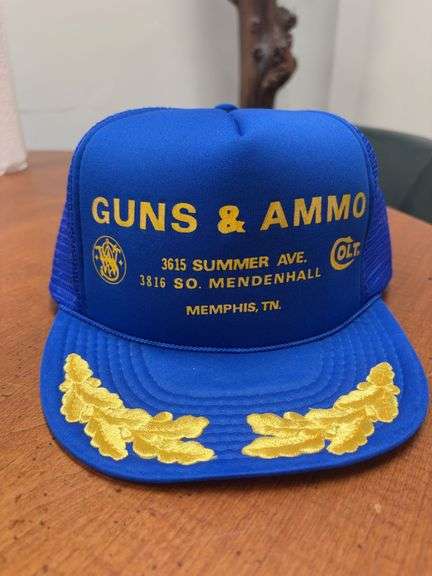Memphis Blue and Gold Guns & Ammo 23” Band Trucker Hat image