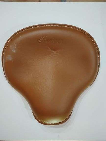 INDIAN BOBBER SEAT ASSEMBLY, TAN, (ANNIVERSARY EDITION) PART # 2686486-LTA SIEGE/SEAT, seat has some indentions and scuffing, NEW NEVER INSTALLED, one screw missing from braket image