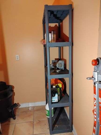 Shelving unit, black plastic, 5 tier, used, some staining bottom shelf, 74" T x 34"W x 14 1/4"D. Other contents not included. image